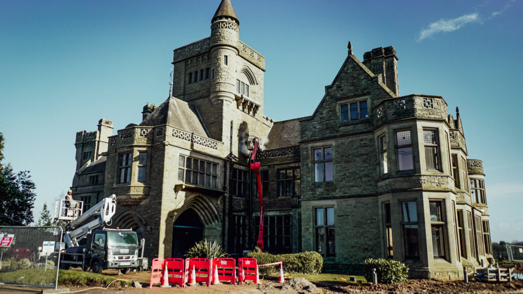 Historic stone building undergoing restoration work