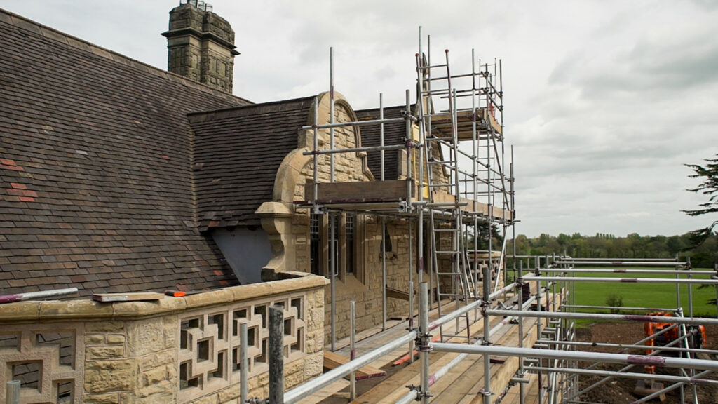 Grade 2 listed tone building surrounded by scaffold. 