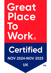 Red and blue badge stating Great Place To Work Certified NOV 2024-NOV 2025 UK in bold white letters.